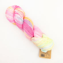 Load image into Gallery viewer, A skein of Araucania Huasco Cotón Glisten yarn in pink and yellow.
