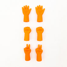 Load image into Gallery viewer, Orange knitting needle point protectors in the shapes of hands
