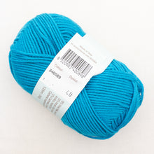 Load image into Gallery viewer, A skein of bright turquoise Debbie Bliss Baby Cashmerino yarn on a white background.