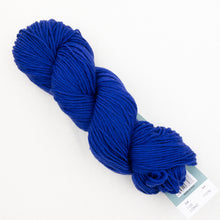 Load image into Gallery viewer, A skein of royal blue Plymouth DK Merino Superwash yarn on a white background.