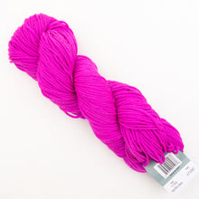Load image into Gallery viewer, A skein of hot pink Plymouth DK Merino Superwash yarn on a white background.
