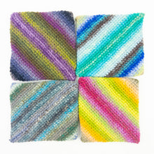 Load image into Gallery viewer, A group of colorful striped crochet potholders