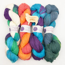 Load image into Gallery viewer, Four skeins of variegated Lornas Laces Solemate sock yarn on a white background