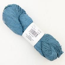 Load image into Gallery viewer, A blue skein of BC Garn Soft Silk yarn on a white background.