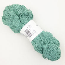Load image into Gallery viewer, A sea green skein of BC Garn Soft Silk yarn on a white background.