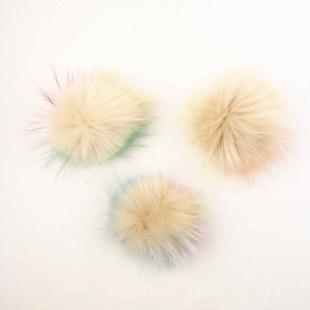 Fur pompoms for hats made of natural fox and raccoon fur