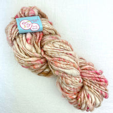 Load image into Gallery viewer, A peach, pink, and cream skein of Knit Collage Cast Away yarn.