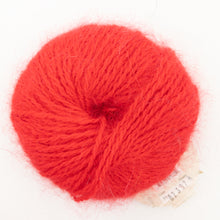 Load image into Gallery viewer, A ball of red Plymouth Angora yarn on a white background.
