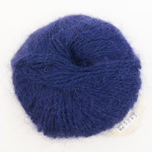 Load image into Gallery viewer, A ball of navy blue Plymouth Angora yarn on a white background.
