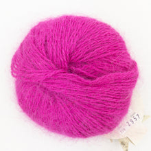 Load image into Gallery viewer, A ball of bright pink Plymouth Angora yarn on a white background.
