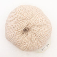 Load image into Gallery viewer, A ball of light tan Plymouth Angora yarn on a white background.
