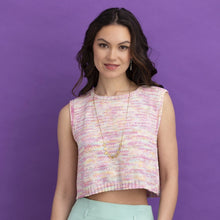 Load image into Gallery viewer, Woman wearing a sleeveless, multicolored top against a purple background
