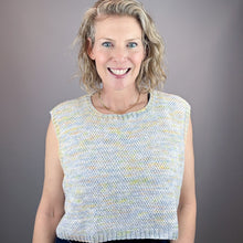 Load image into Gallery viewer, Woman wearing a multi color sleeveless knit top against a gray background
