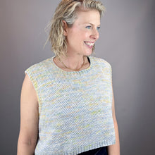 Load image into Gallery viewer, Woman wearing a light blue and yellow knit sleeveless sweater against a gray background
