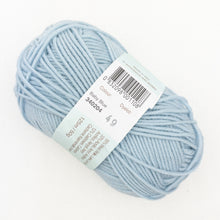 Load image into Gallery viewer, A skein of light blue Debbie Bliss Baby Cashmerino yarn on a white background.
