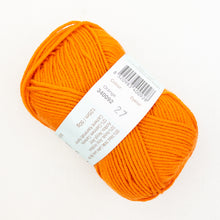 Load image into Gallery viewer, A skein of bright orange Debbie Bliss Baby Cashmerino yarn on a white background.

