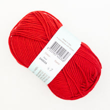 Load image into Gallery viewer, A skein of bright red Debbie Bliss Baby Cashmerino yarn on a white background.
