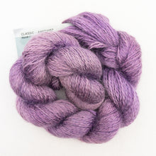 Load image into Gallery viewer, A purple skein of Colinton Lace yarn on a white background.
