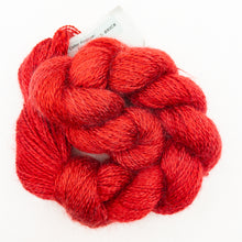 Load image into Gallery viewer, A red skein of Colinton Lace yarn on a white background.
