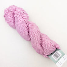 Load image into Gallery viewer, A skein of light pink Plymouth DK Merino Superwash yarn on a white background.
