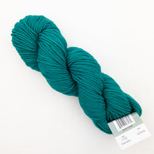 Load image into Gallery viewer, A skein of teal Plymouth DK Merino Superwash yarn on a white background.
