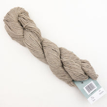 Load image into Gallery viewer, A skein of tan Plymouth DK Merino Superwash yarn on a white background.
