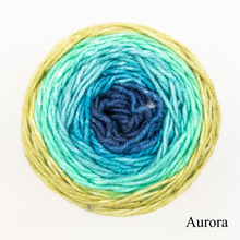 Load image into Gallery viewer, A blue and green ball of Freia Merino Silk Worsted ombre yarn 
