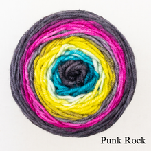 Load image into Gallery viewer, A neon rainbow and black ball of Freia Merino Silk Worsted ombre yarn 
