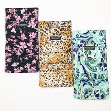 Load image into Gallery viewer, Three Atelier Yarns Interchangeable Knitting Needle Cases in Cherry Blossom, Cheetah, and Green Wave prints on a white background
