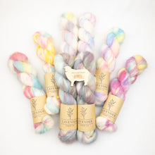 Load image into Gallery viewer, Pastel-colored yarn skeins with 'Lavender Fiber Co.' labels on a white background
