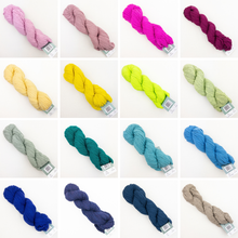 Load image into Gallery viewer, A 4x4 grid showing 16 different skeins of Plymouth DK Merino Superwash yarn yarn in various colors on a white background, including pink, mauve, magenta, burgundy, yellow, lime green, sage green, light gray, teal, turquoise, royal blue, navy, and taupe.
