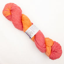 Load image into Gallery viewer, A pink and orange variegated skein of Lornas Laces Solemate sock yarn on a white background.
