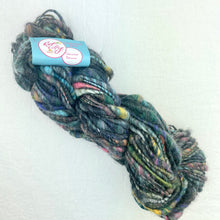 Load image into Gallery viewer, A charcoal multicolor skein of Knit Collage Cast Away yarn.
