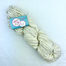 Load image into Gallery viewer, A cream skein of Knit Collage Cast Away yarn.
