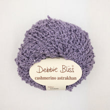 Load image into Gallery viewer, A purple ball of Debbie Bliss Astrakhan yarn on a white background
